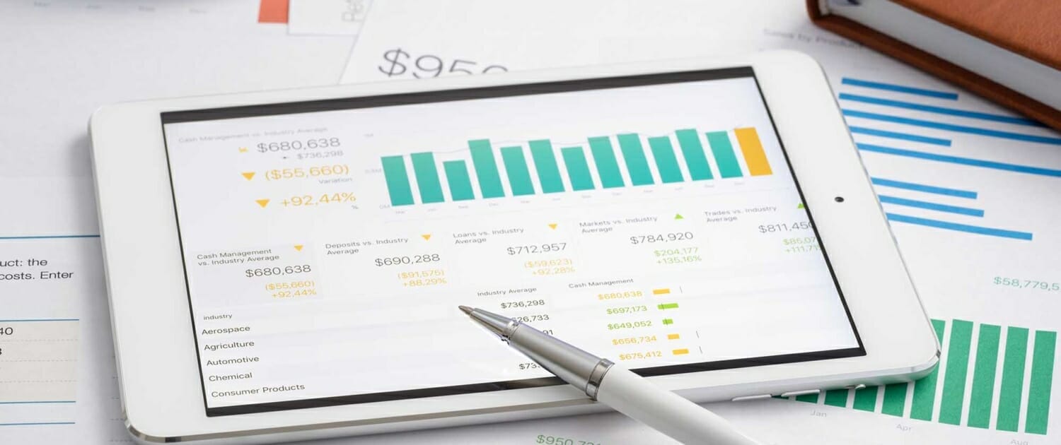 Close up view of various charts and graphs on a tablet